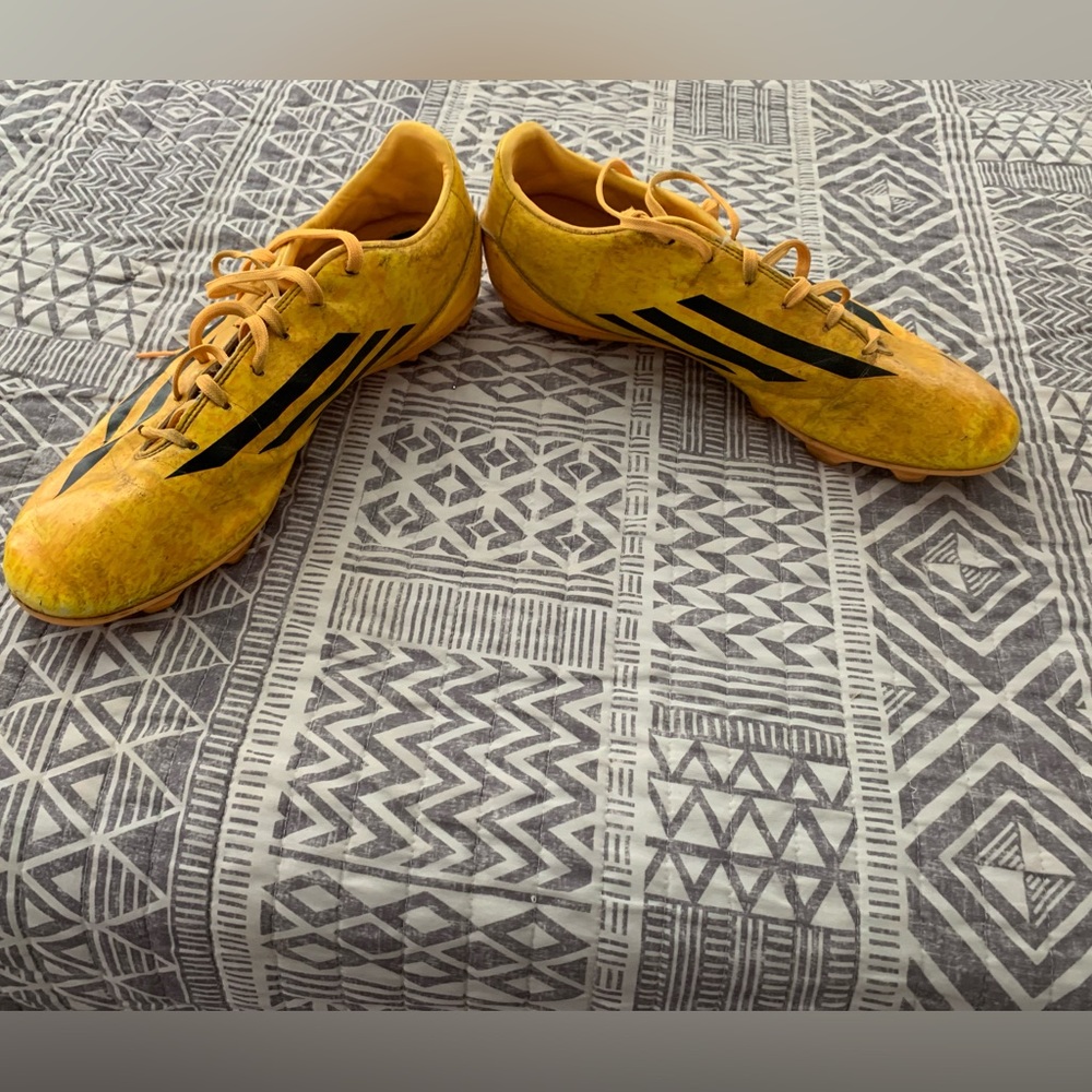 Adidas f10 size 12 cleats, cool yellow and orange pattern, worn for 2 games.